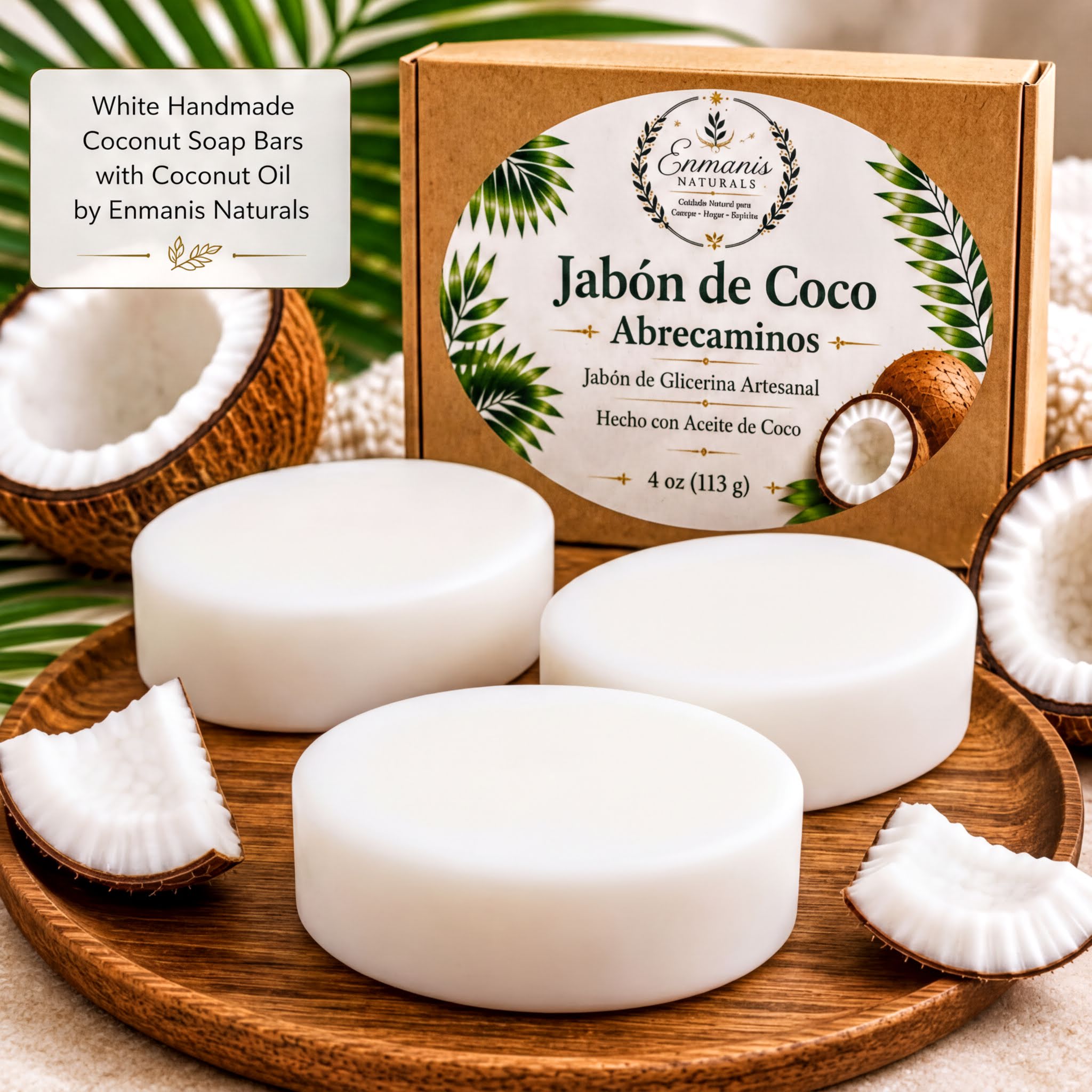 a set of white coconut soap bars with a box of the same soap bars, along with some coconut pieces and a palm leaf.