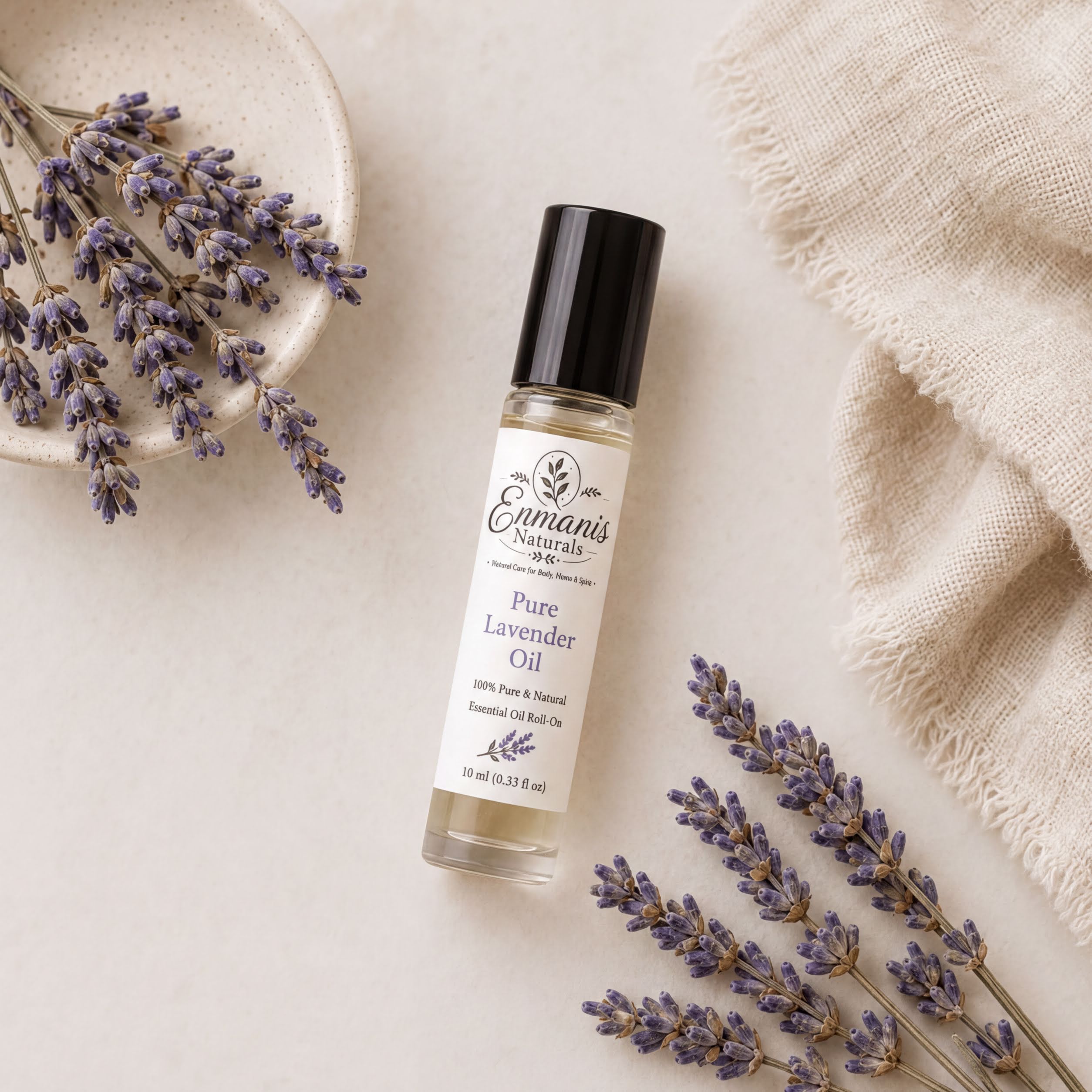 a bottle of pure lavender oil, surrounded by dried lavender flowers and a beige cloth.