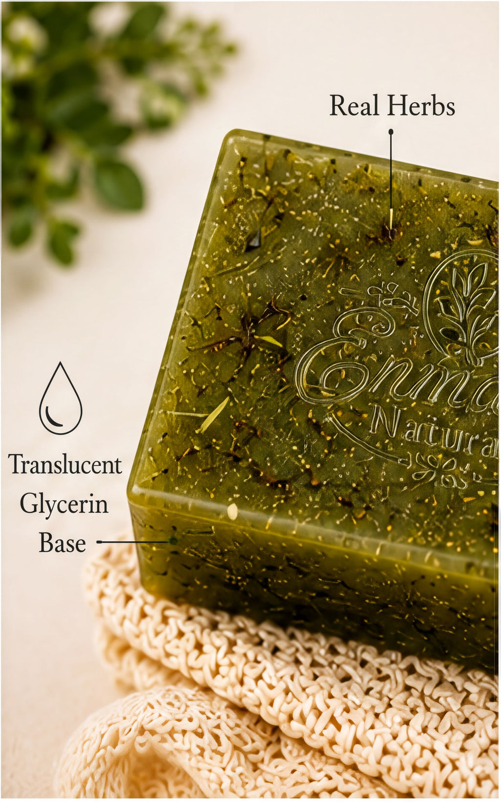 a green bar of soap with a transparent glycerin base, placed on a white cloth.