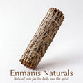 A bundle of natural materials, possibly herbs or leaves, tied together with a string.