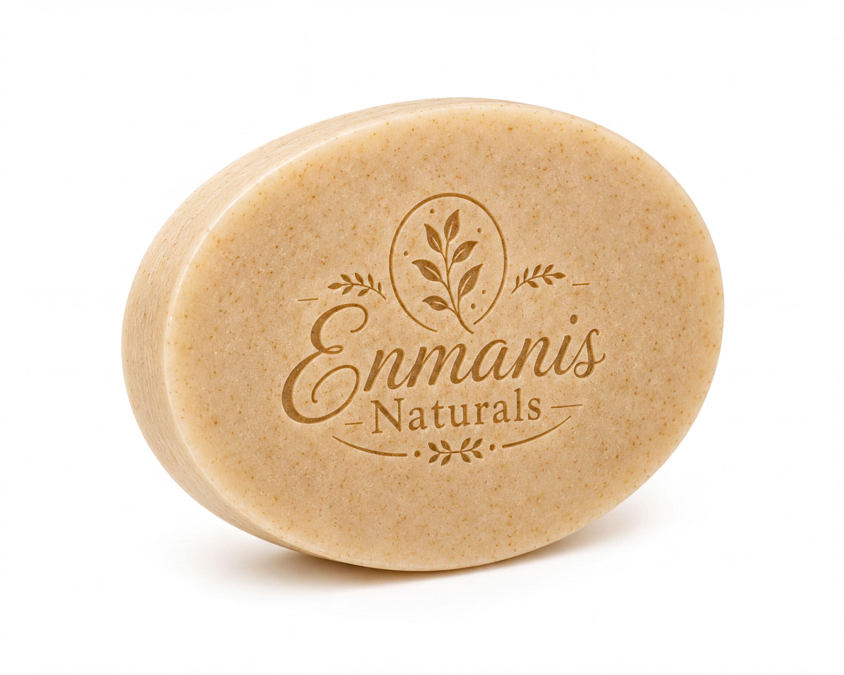 An oval-shaped bar of soap with the text "Enmanis Naturals" printed on it.