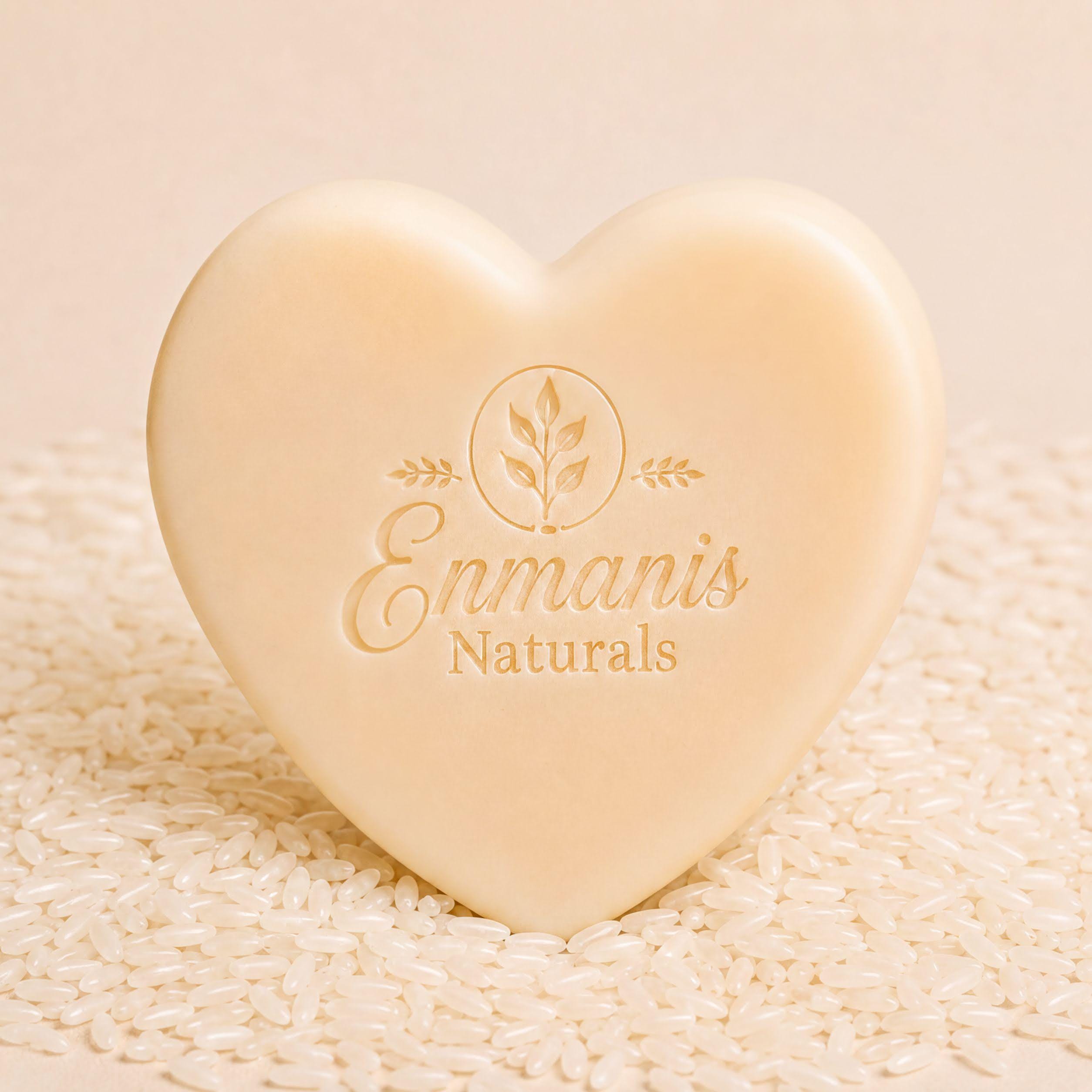 A heart-shaped object with embossed text and a leaf design, placed on a bed of rice.