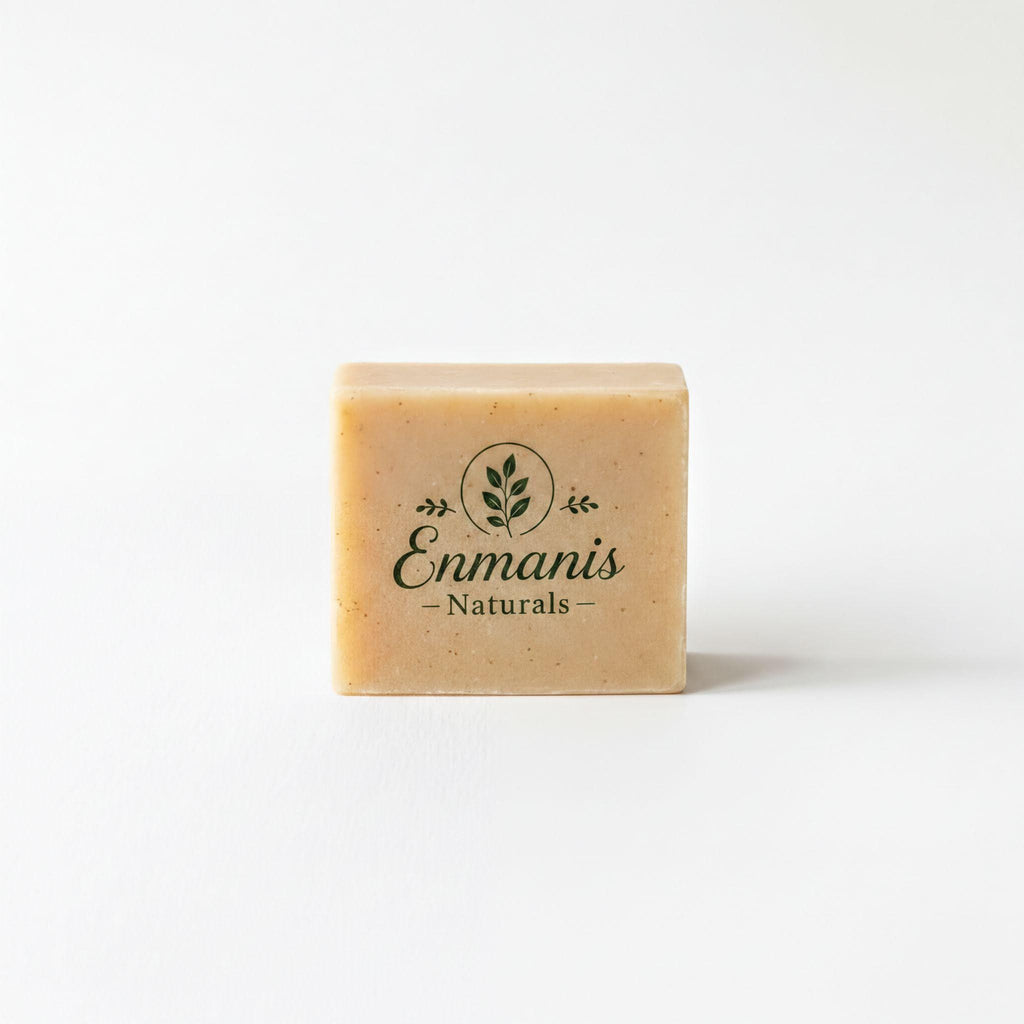 A rectangular bar of soap with the text "Enmanis Naturals" printed on it.